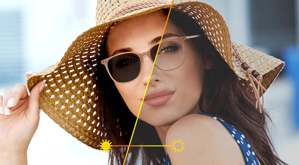 Woman wearing a straw hat and transitions lenses sunglasses with a blurred background